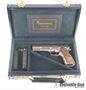 Picture of Browning Hi-Power JMB Custom Renaissance Silver Single Action Semi-Auto Pistol - 9mm, 4-5/8", Nickel Plated, Floral Engraved, Hand Checkered & Carved Walnut Grips, 2x10rds, Fixed Sights, With Display Case