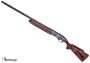 Picture of Used Remington Model 1100 Classic Trap Semi-Auto Shotgun - 12Ga, 2-3/4", 28", Vented Rib, High Polish Blued, Engraved Receiver w/ Gold Inlay, Hi-Gloss American Walnut Stock, 4rds, Twin Bead Sights, 5 Chokes, Very Good Condition