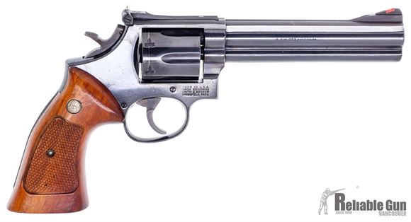 Picture of Used Smith & Wesson 586 Double Action Revolver, 357 Mag, 6 Shot, 6" Blued, Adjustable Rear Sight, Full Underlug, Wood Grip, Square Butt, Good Condition